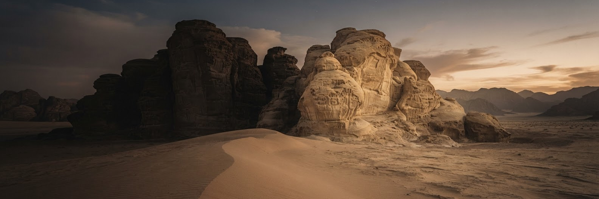 A sculptural desert landscape at dusk