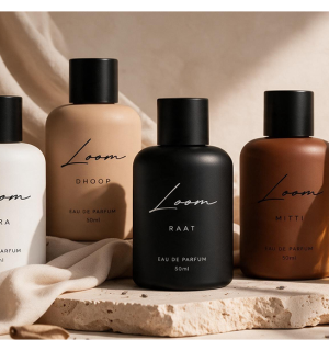 The five LOOM fragrances on linen in warm light