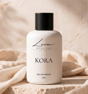 KORA Eau de Parfum on stone and linen